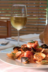 Shrimp dish with glass of white wine - clipping path