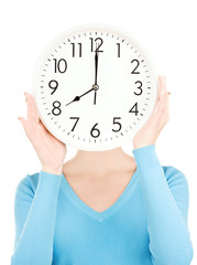 woman with big clock covering face