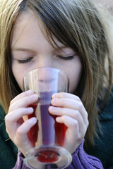 little girl drinking cup of tea