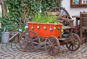 Old wagon with flowers. Homestead.