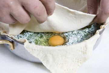 preparing Easter pie. Eggs in stuffing
