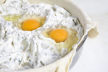 preparing Easter pie. Eggs in stuffing