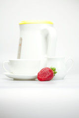 juicy strawberries and tableware isolated on white