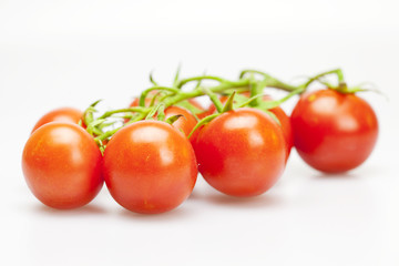 juicy tomatoes isolated on white