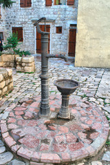 Old water pump in the old town. Kotor, Montenegro. HDRI image