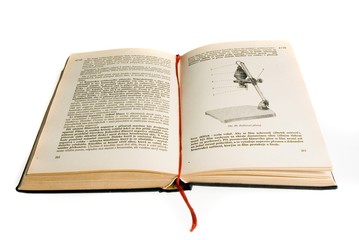 Fototapeta premium Open old book with enlarger on white background