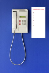 Wall phone on blue background