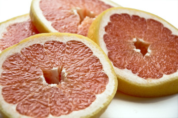 Cut slices of ripe, juicy fresh oranges. Isolation on white