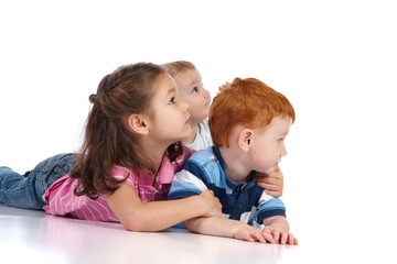 Obraz na płótnie Canvas Three kids watching