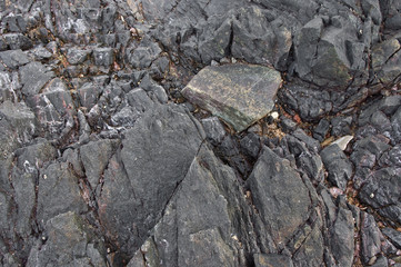 The dark rock on the beach, Thailand
