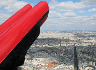 Binoculars against aerial panorama of Paris