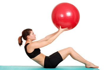 young woman working out with ball
