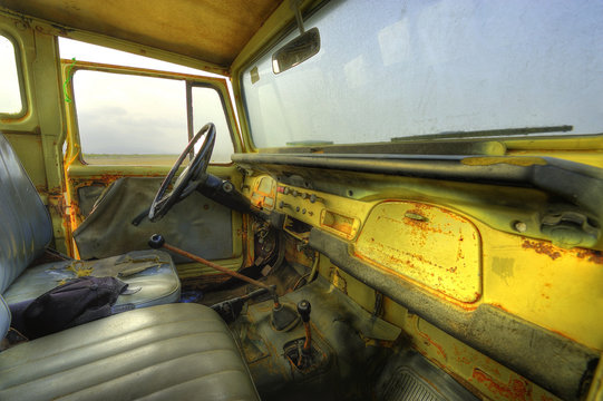 Abandoned car on car