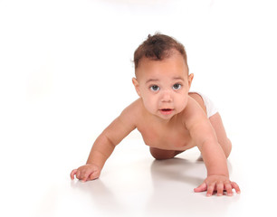 Infant Baby Boy Learning to Crawl on White