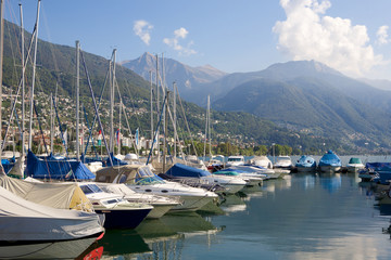 Fototapeta na wymiar Yachts Locarno wharf at lake Maggiore, Switzerland