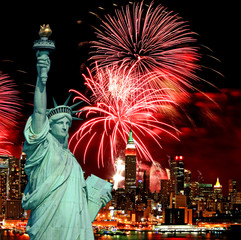 The Statue of Liberty and holiday fireworks © Gary
