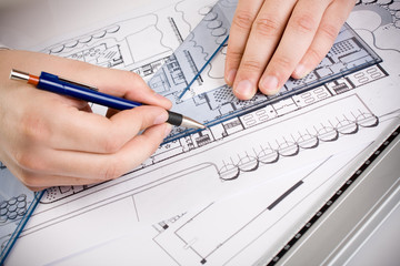 Architectural plans and blueprints in office