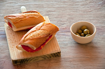 food still life with sandwich and olives