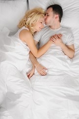 Young couple sleeping in a bed