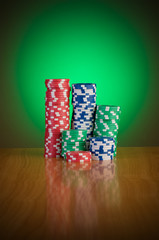 Stack of casino chips against gradient background