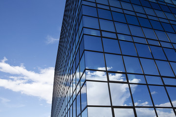 Corporate building, clouds reflection