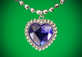 Silver pendant isolated on the colourful background