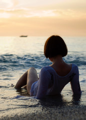 Fototapeta na wymiar a girl on seashore
