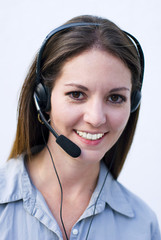 Happy phone operator answering costumers telephone calls