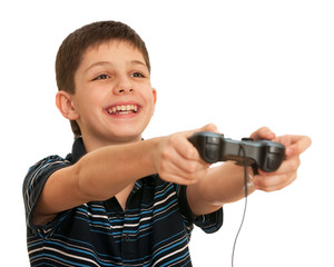 Laughing boy playing a computer game with joystick