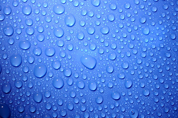 blue water drops on glass