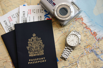 Passport, air ticket, camera and map.