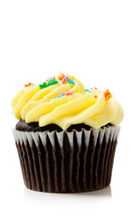 Yellow chocolate cupcakes on white