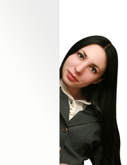 young business woman holding empty large white billboard