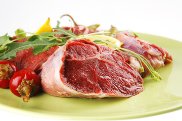 fresh beef medallion on green