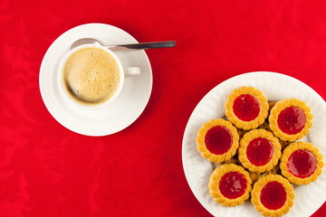 Coffee and cookies on a red background
