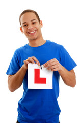 Teenage boy tearing L plate