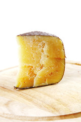 cheddar cheese on wooden board