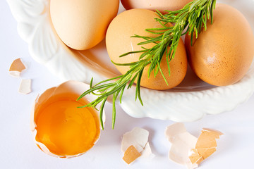 eggs and rosemary on white