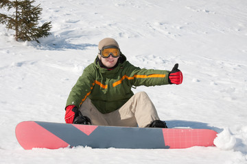Fototapeta na wymiar Young man with snowboard