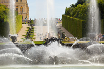 Neptune fountain spraying water in Versailles Chateau. France