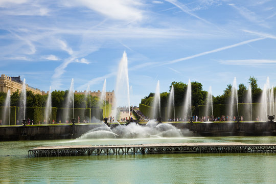 Neptune fountain spraying water in Versailles Chateau. France