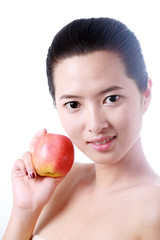 Close-up portrait of sexy asian young woman holding one apple