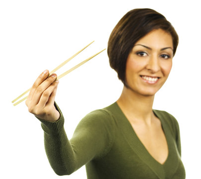 Young Woman Holding Chopsticks With Nothing Between Them