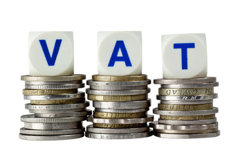 Stacks of coins with the letters VAT isolated on white