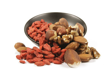 Goji Berries and Nuts Spilling from a Bowl
