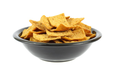 Seasoned pita chips in a black bowl