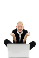young businesswoman sitting on the floor with laptop
