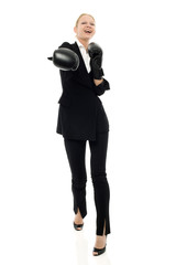 businesswoman smiling with boxing gloves