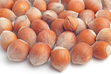 Lots of hazelnuts with kernel on top and selective focus