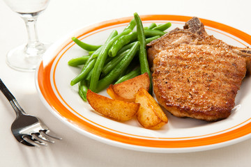 Grilled steak with chips and vegetables